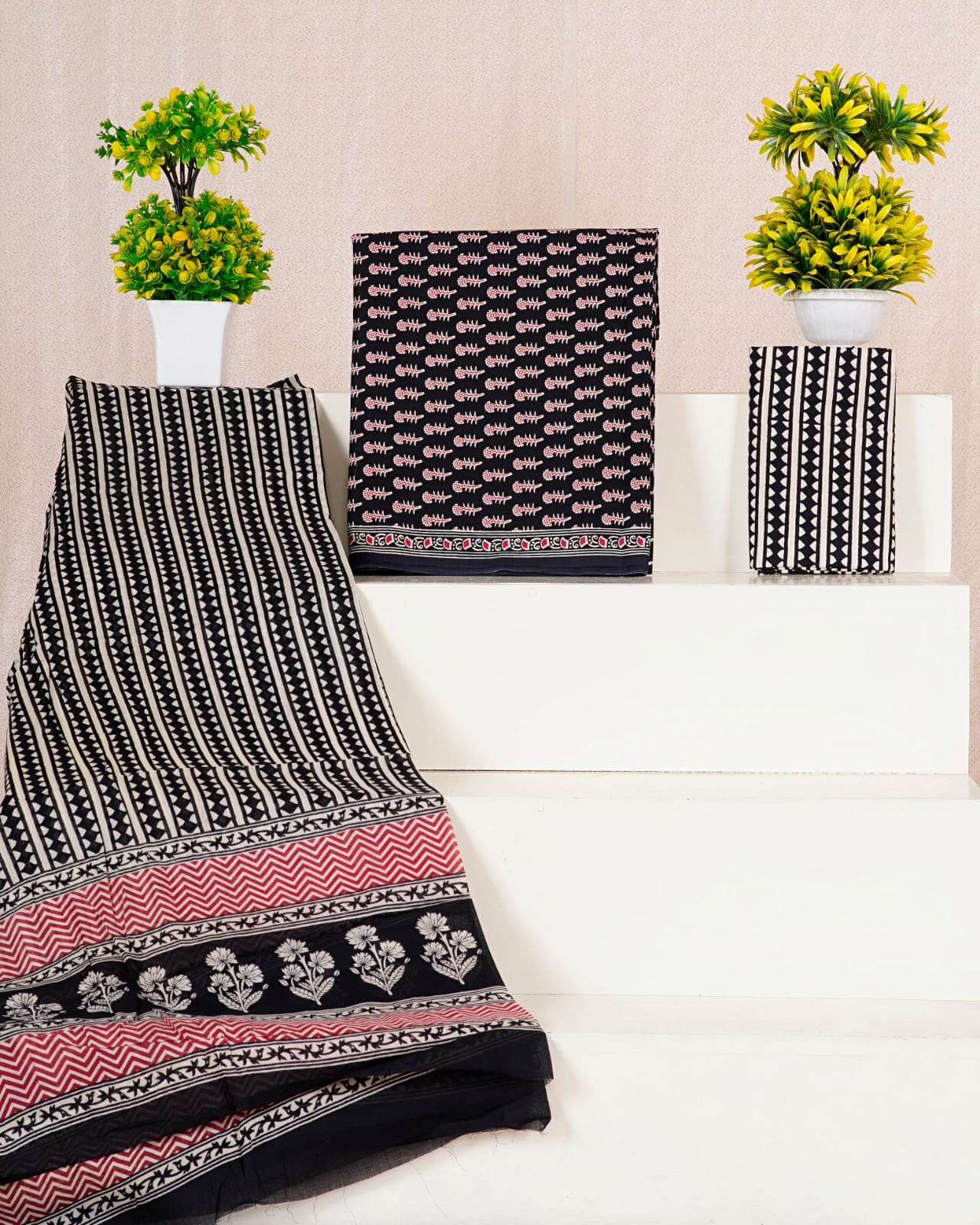 Black with Red,Cream motifs on the cotton dress material