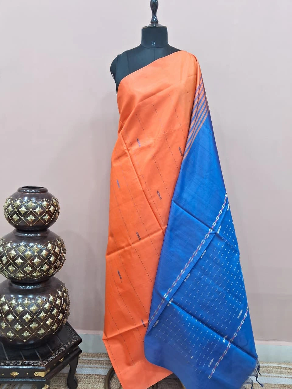 An orange handwoven banana silk saree 