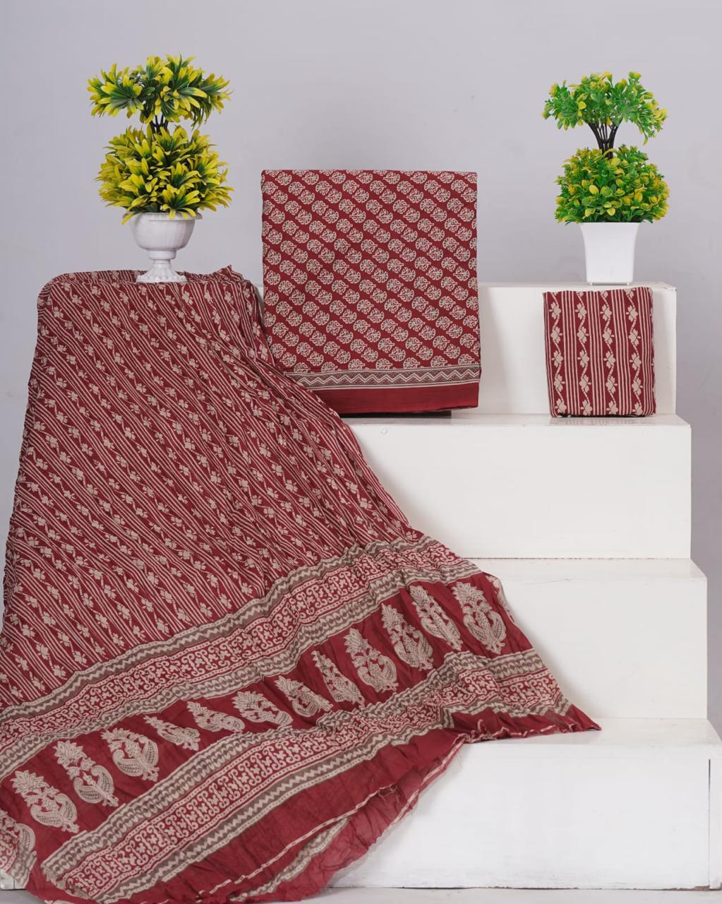 Rust Red with white floral motis on the cotton dress material