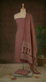 Rust Red with white floral motis on the cotton dress material