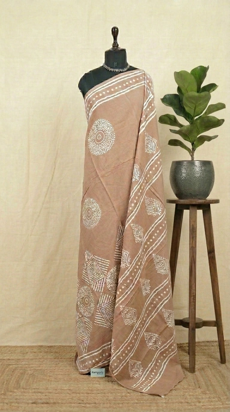 A beige soft cotton saree