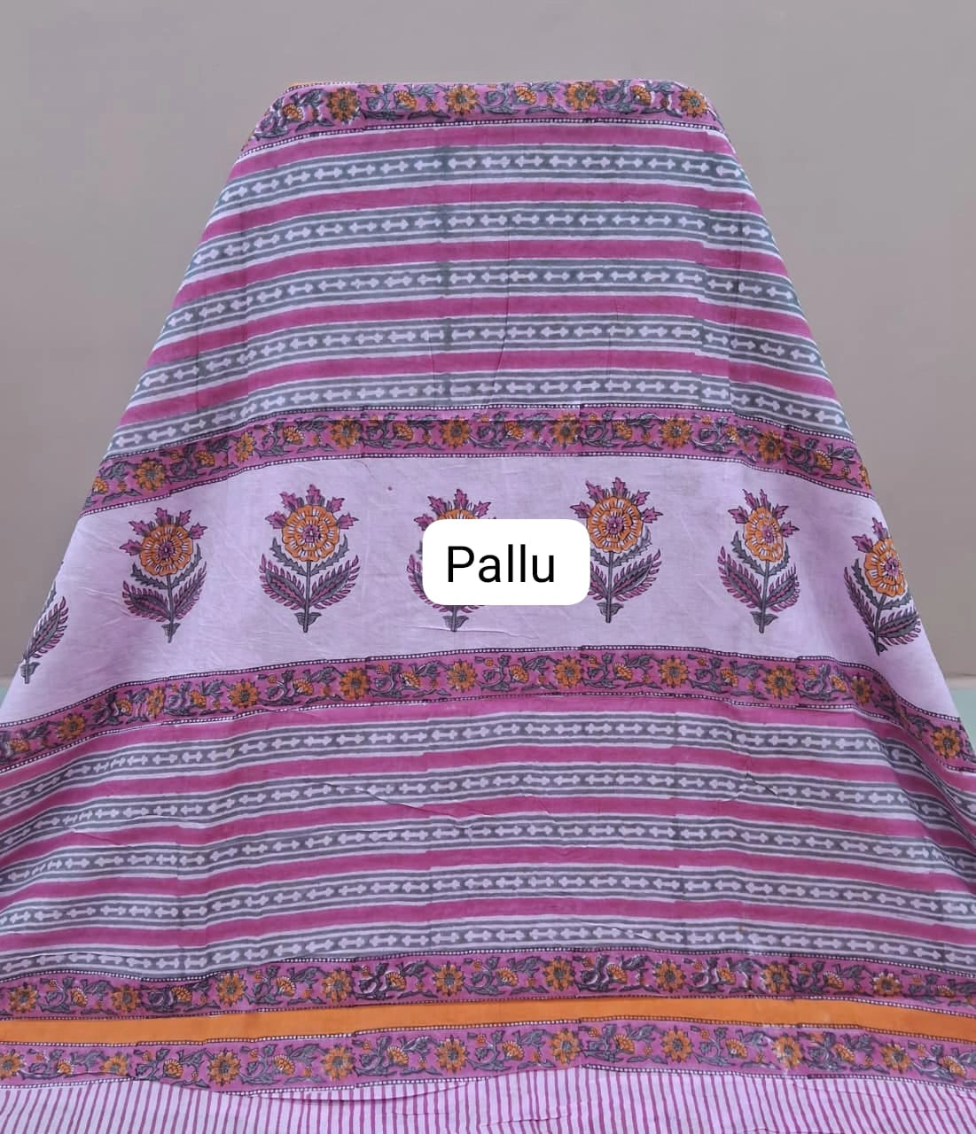 A graceful baby pink soft cotton saree pallu