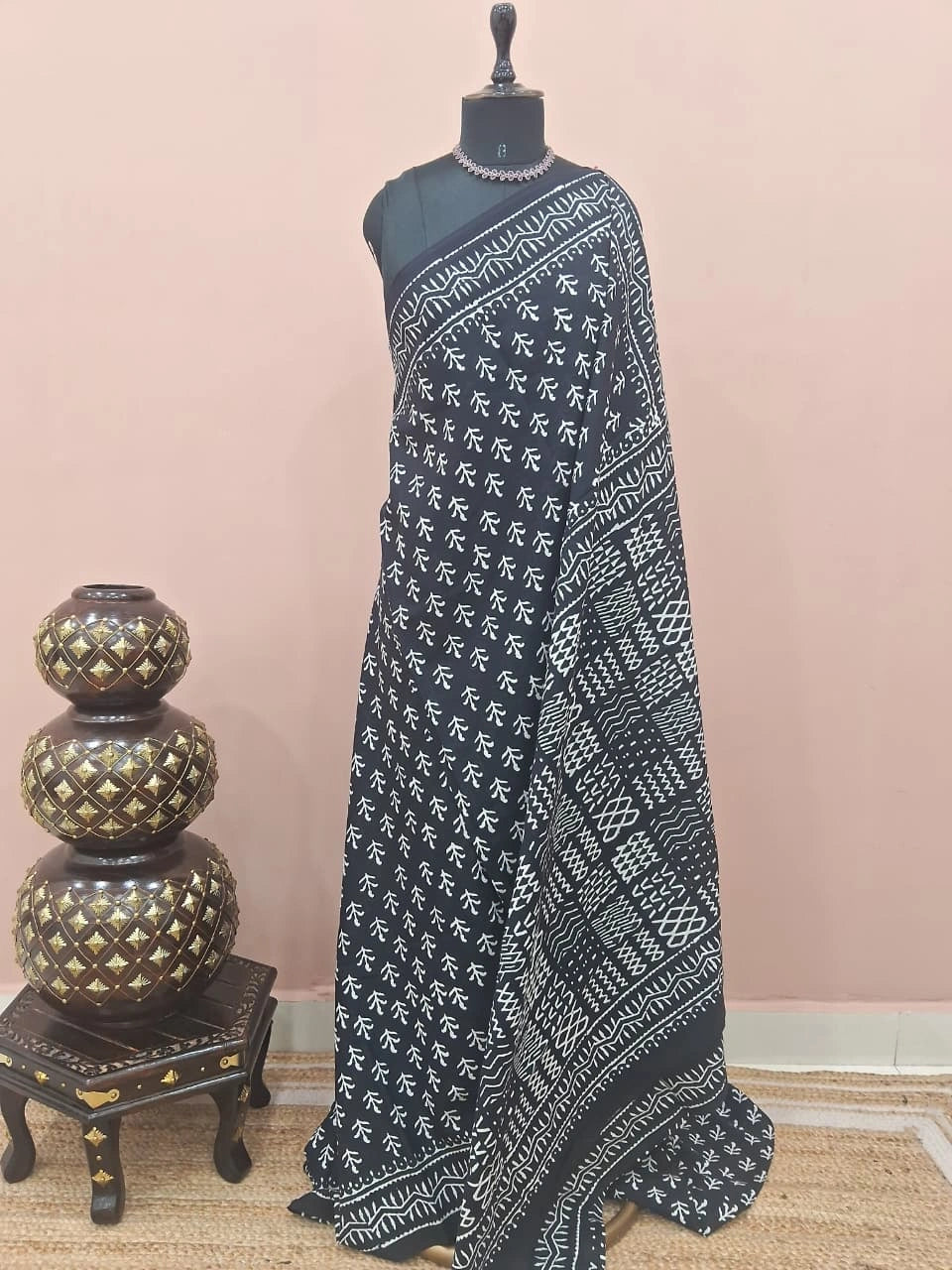 A graceful black soft cotton saree