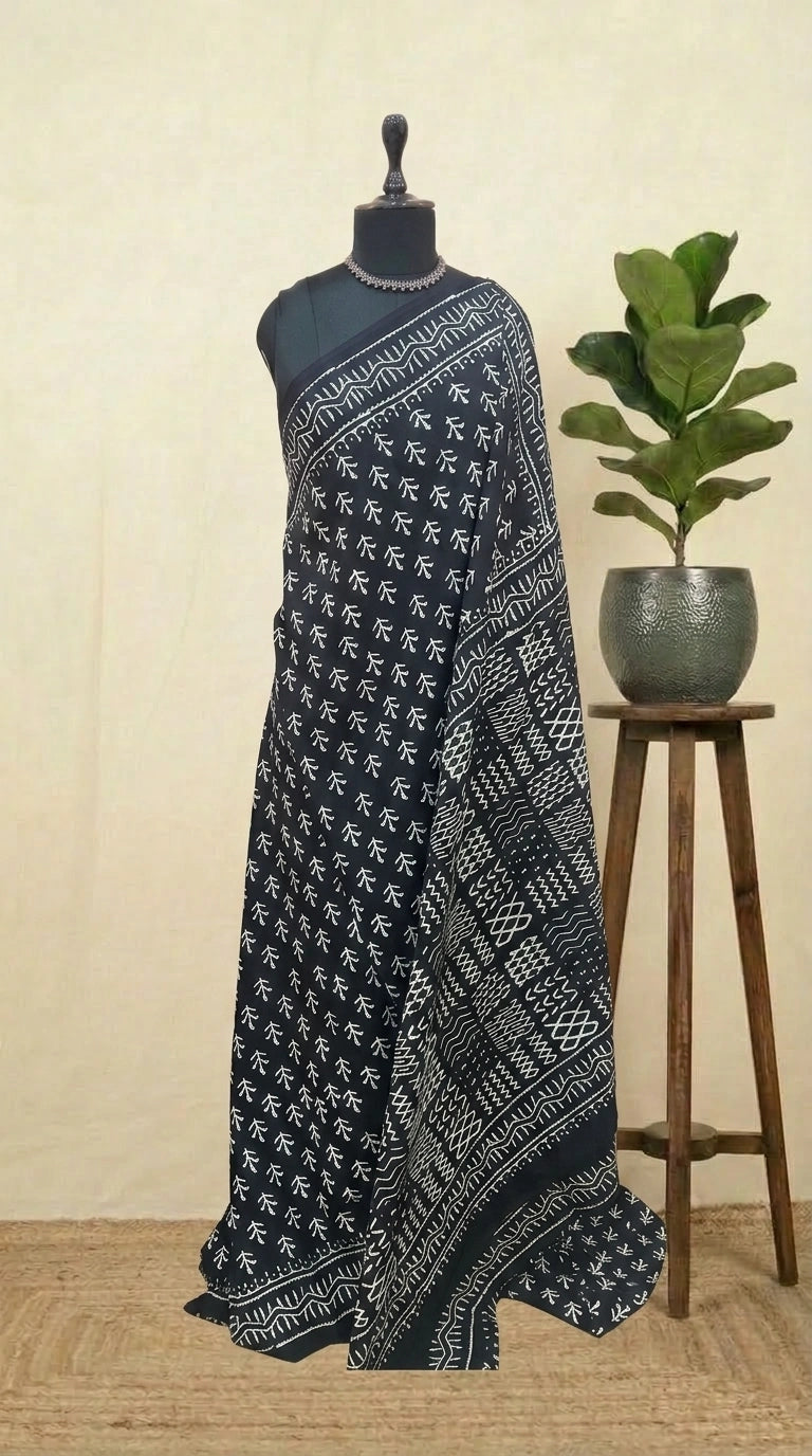 A graceful black soft cotton saree