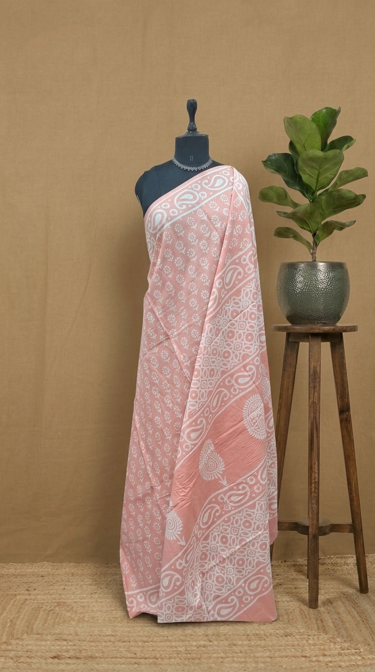 A graceful peach soft cotton saree