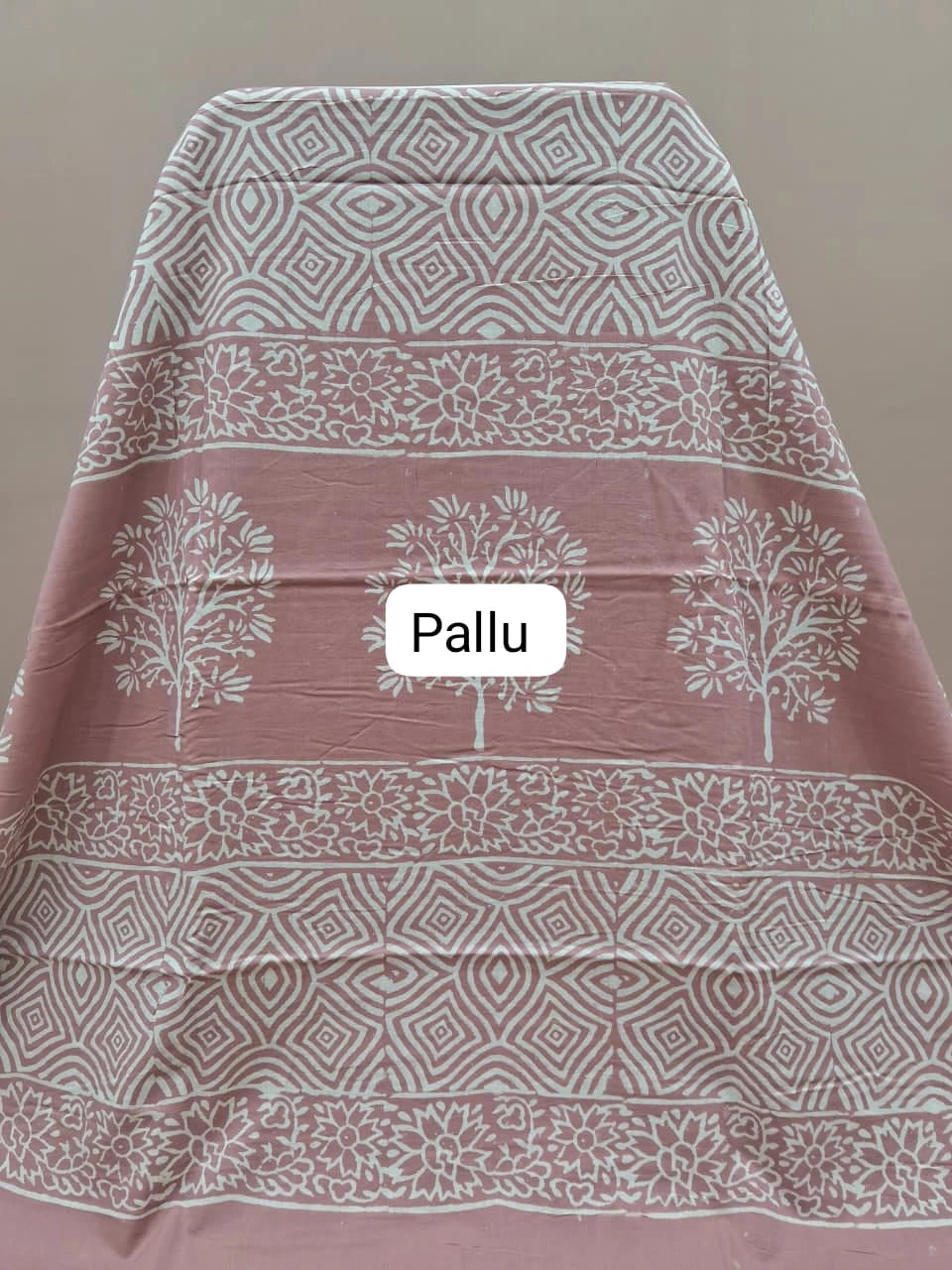 A graceful taupe brown soft cotton saree pallu