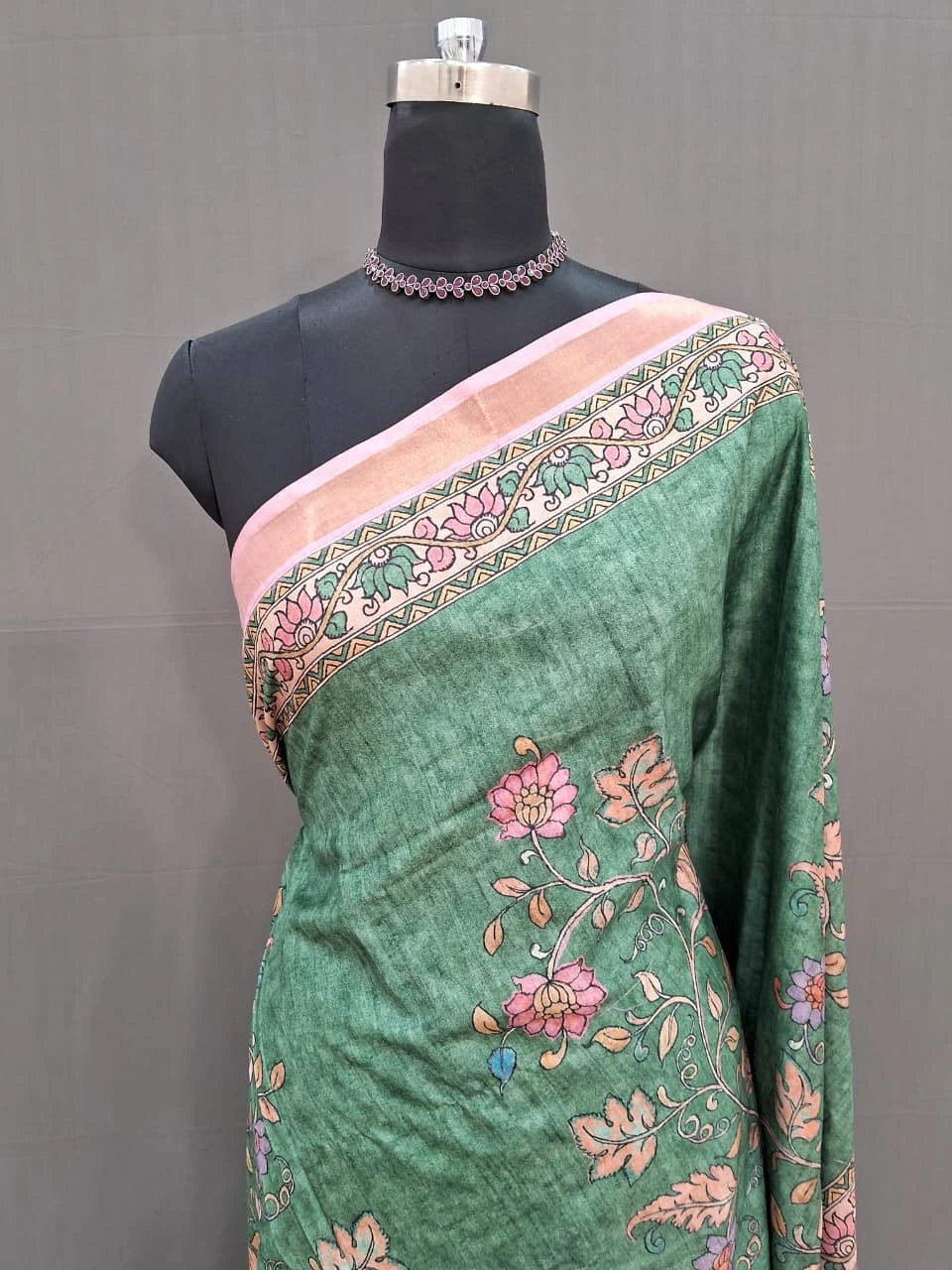 Green semi Tussar saree with a floral print 1