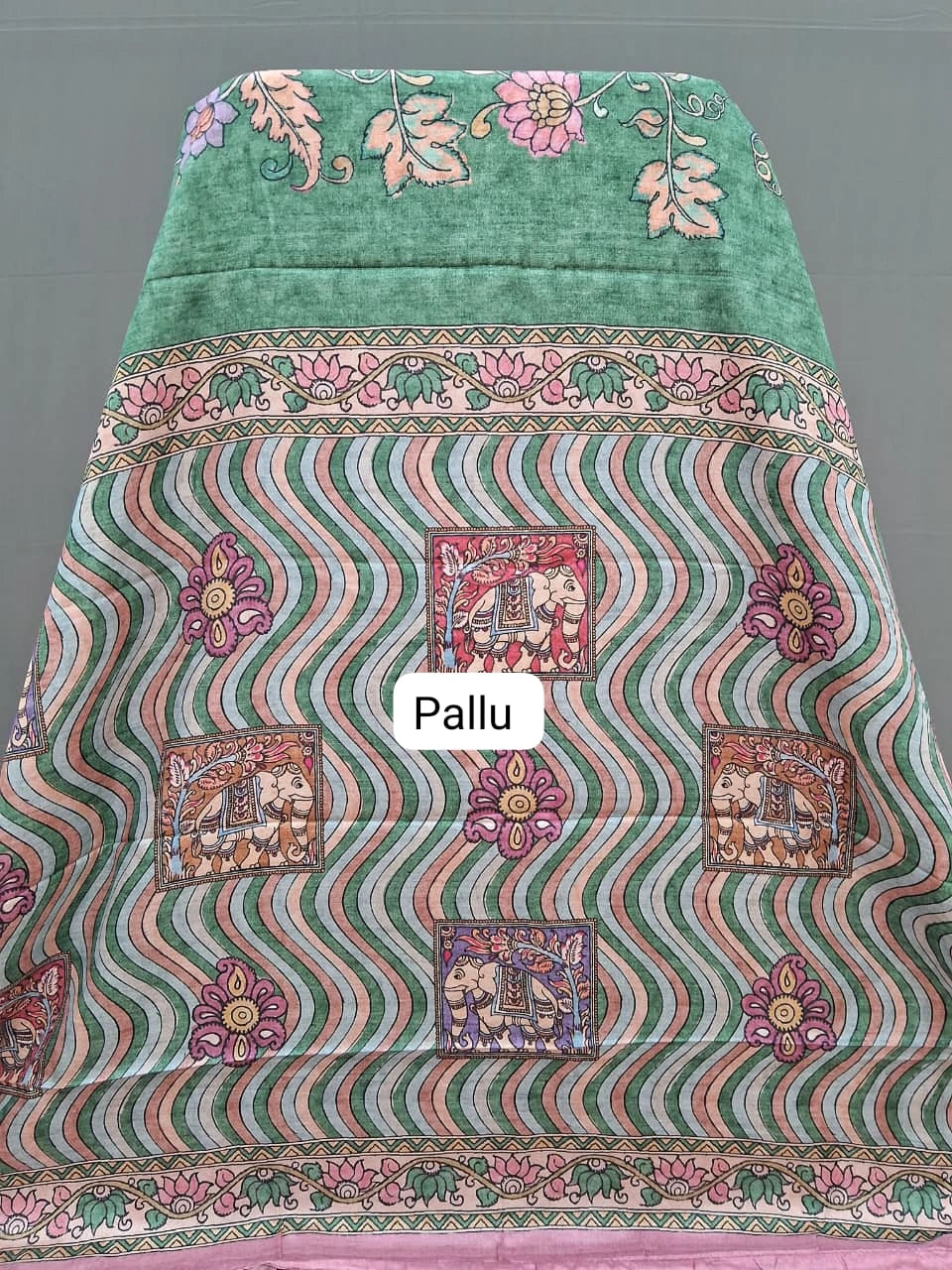 Green semi Tussar saree with a floral print pallu