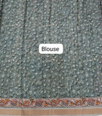 Green semi Tussar saree with a floral print blouse