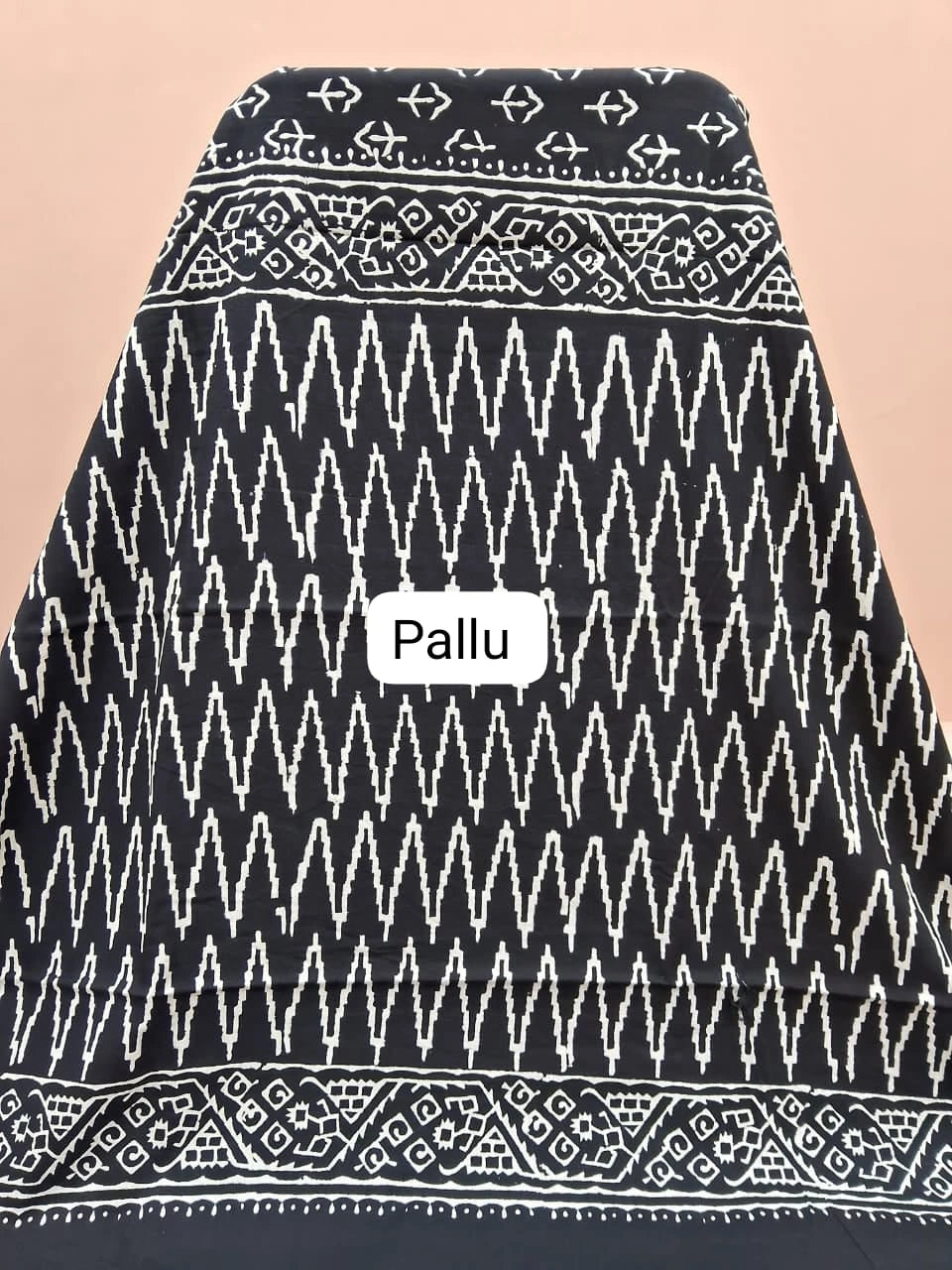 A striking black mulmul zari cotton saree pallu