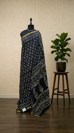 A timeless pure black mulmul zari cotton saree