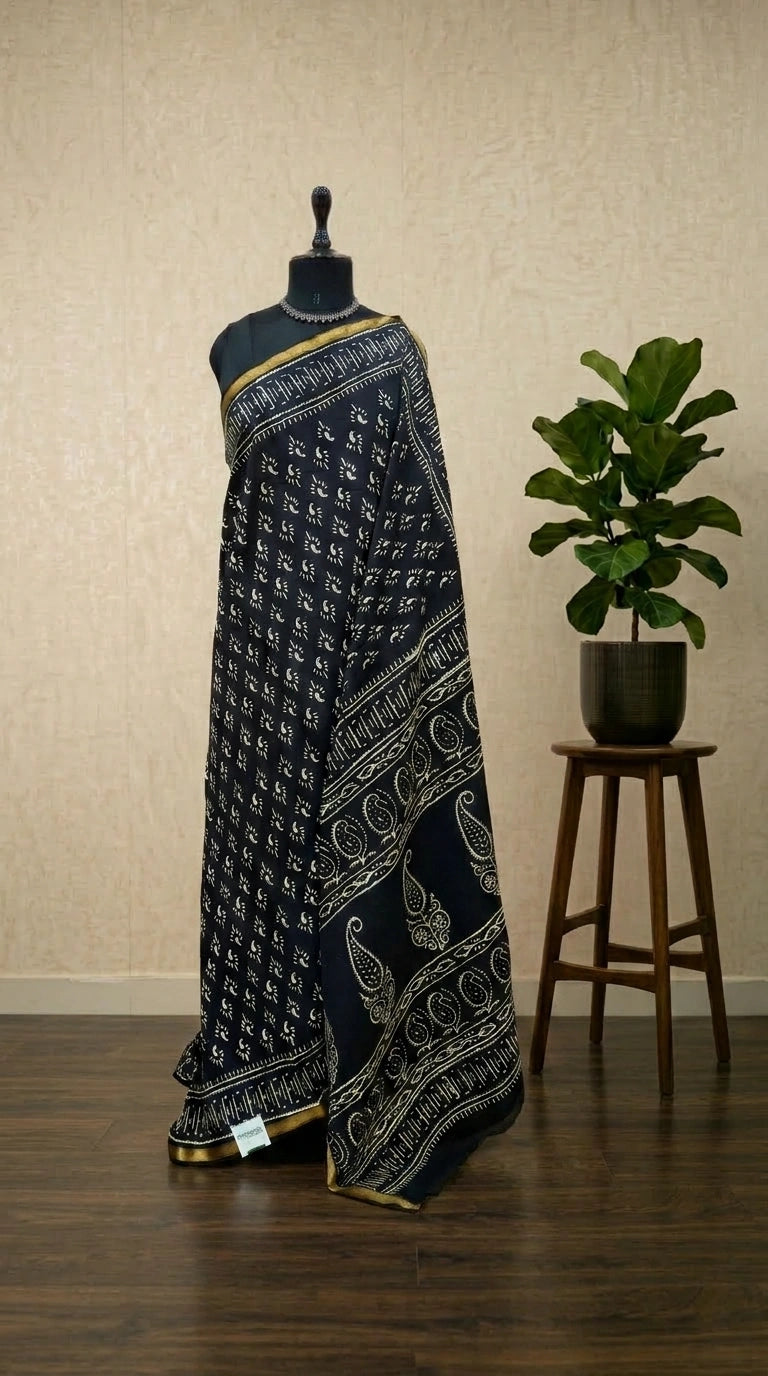 A timeless pure black mulmul zari cotton saree