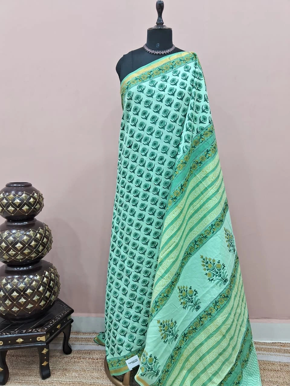 A mint green mulmul zari cotton saree 