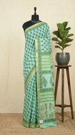 A mint green mulmul zari cotton saree