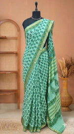 A mint green mulmul zari cotton saree 